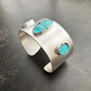 silver cuff bracelet with three turquoise stones