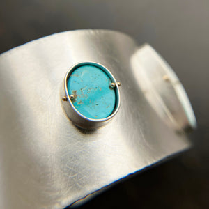 silver cuff bracelet with three turquoise stones