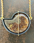 back of ammonite with embedded turquoise necklace in silver and gold on silver and gold chain