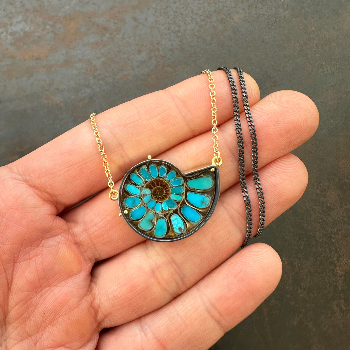 ammonite with embedded turquoise necklace in silver and gold on silver and gold chain