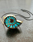 ammonite with embedded turquoise necklace in silver and gold on silver and gold chain