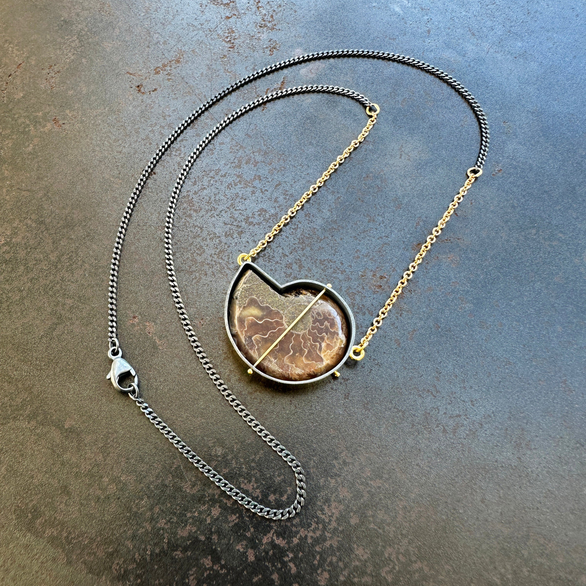 ammonite with embedded turquoise necklace in silver and gold on silver and gold chain