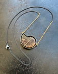ammonite with embedded turquoise necklace in silver and gold on silver and gold chain