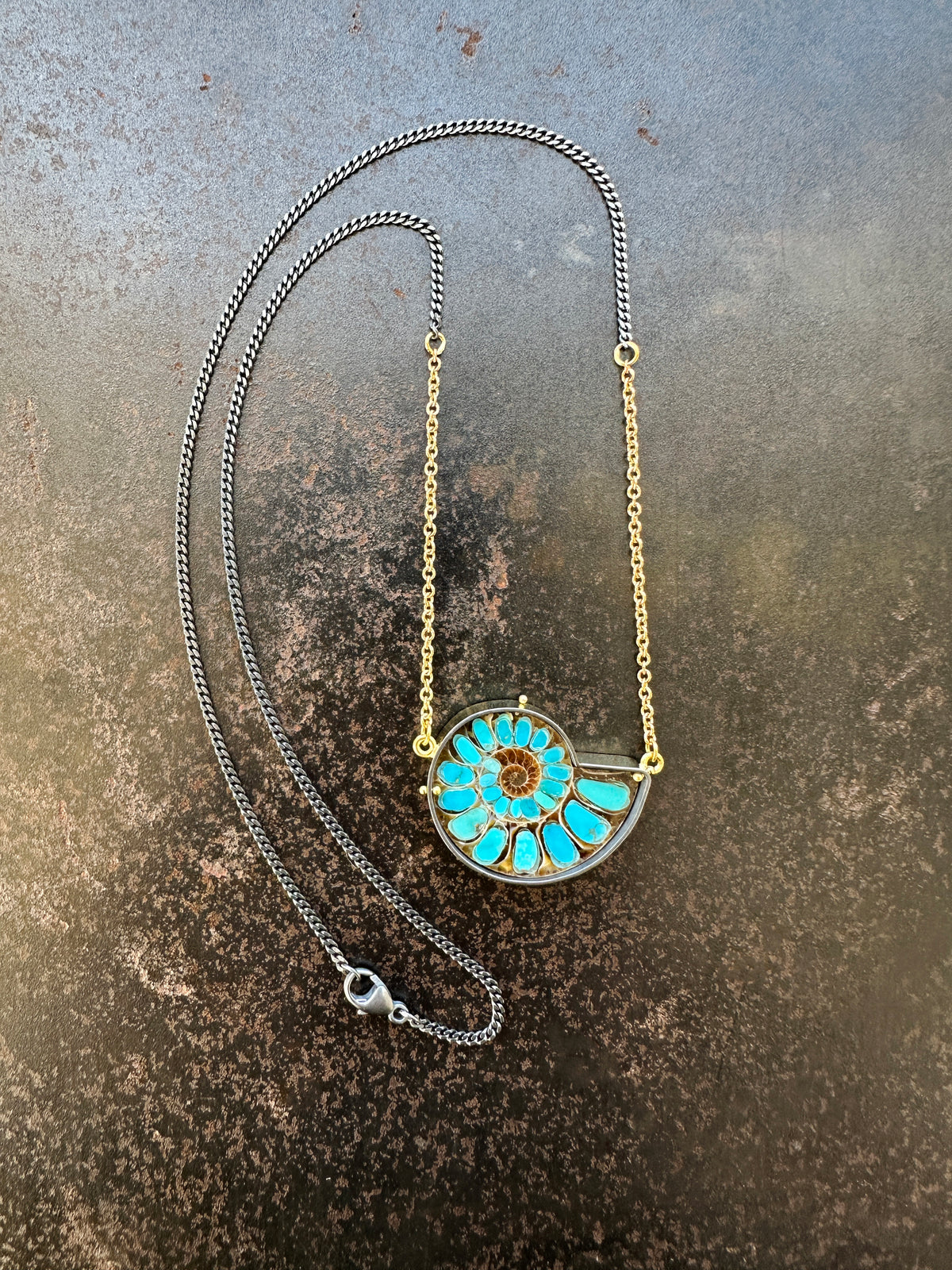 ammonite with embedded turquoise necklace in silver and gold on silver and gold chain