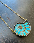 ammonite with embedded turquoise necklace in silver and gold on silver and gold chain
