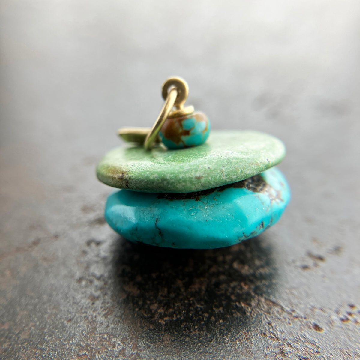 chinese hand carved turquoise beads with an 18k gold bale.