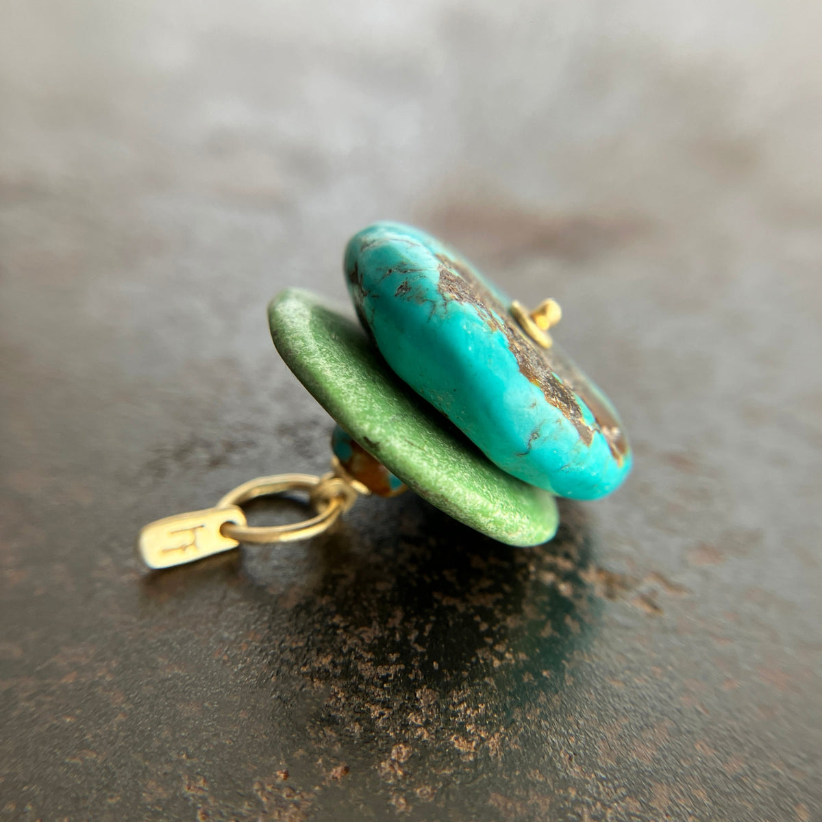chinese hand carved turquoise beads with an 18k gold bale.
