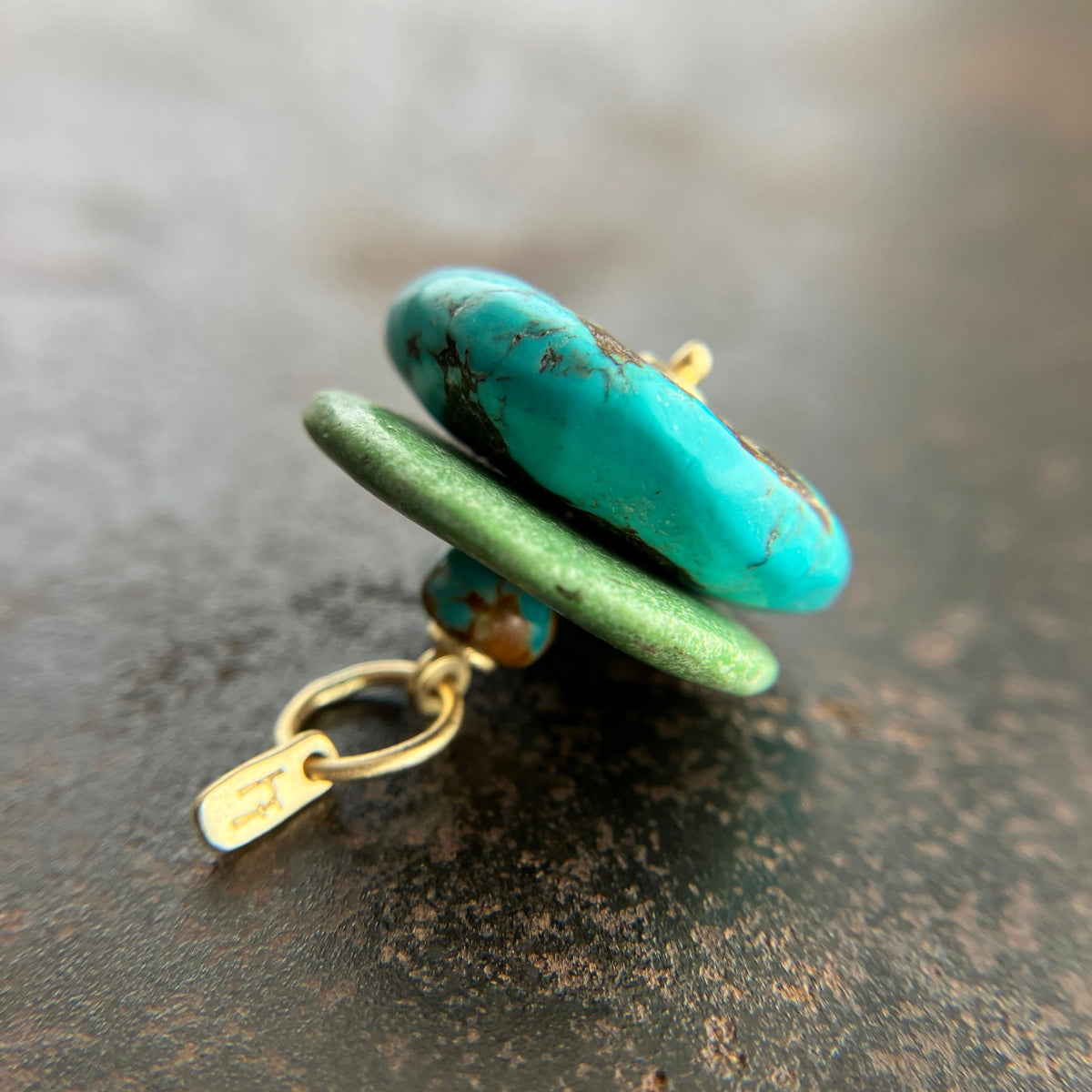chinese hand carved turquoise beads with an 18k gold bale.
