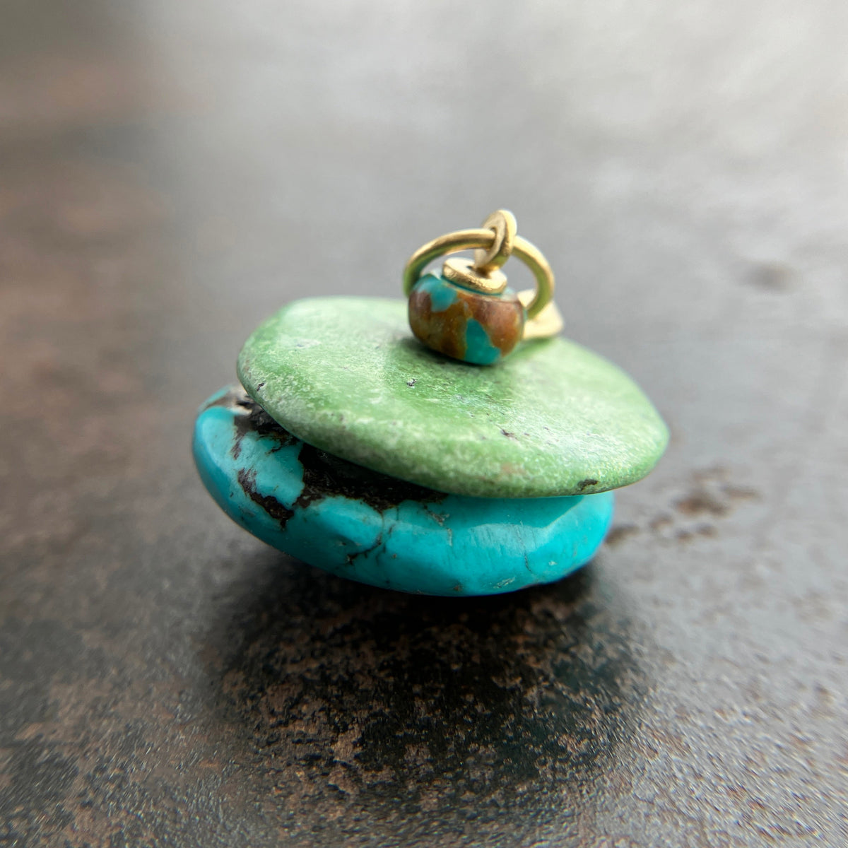 chinese hand carved turquoise beads with an 18k gold bale.