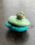 chinese hand carved turquoise beads with an 18k gold bale.