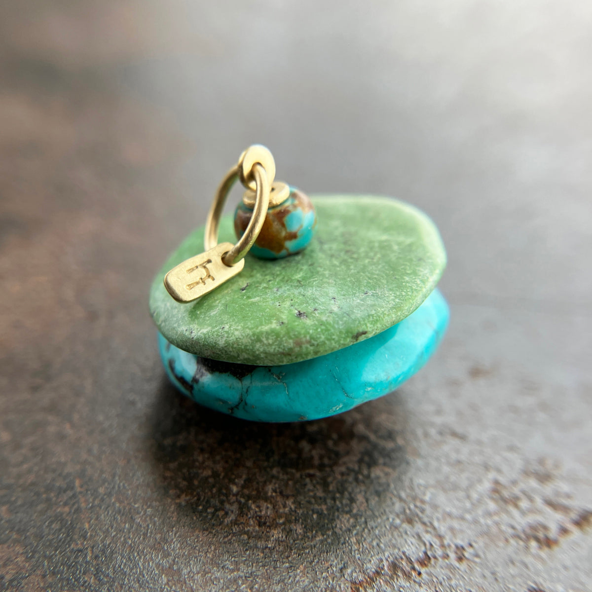 chinese hand carved turquoise beads with an 18k gold bale.