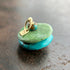 chinese hand carved turquoise beads with an 18k gold bale.