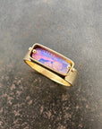 purple wood opal set in an 8k gold ring