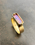 purple wood opal set in an 8k gold ring