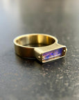 purple wood opal set in an 8k gold ring