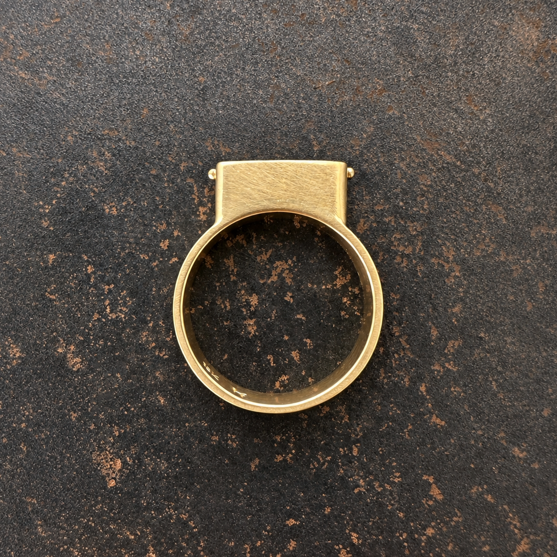 purple wood opal set in an 8k gold ring