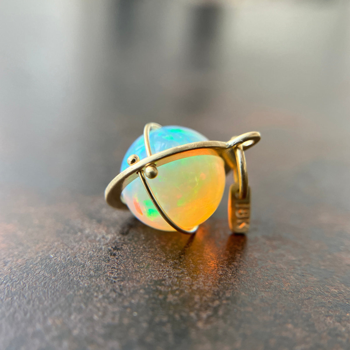 yellow green Ethiopian opal orb pendant set in 18k gold  