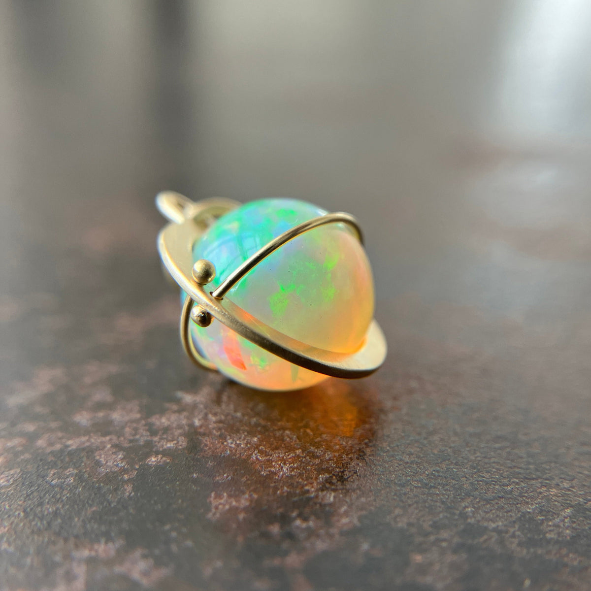 yellow green Ethiopian opal orb pendant set in 18k gold  