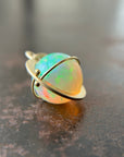 yellow green Ethiopian opal orb pendant set in 18k gold  