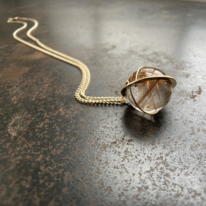 
                
                    Load image into Gallery viewer, Captured Rutilated Quartz Orb Necklace
                
            