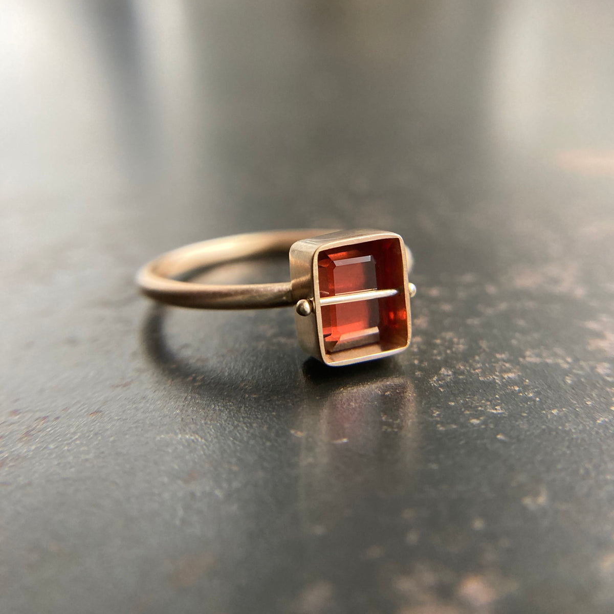 Captured Garnet Ring